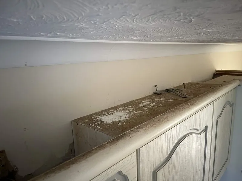 Dusty kitchen unit tops before an end of tenancy clean
