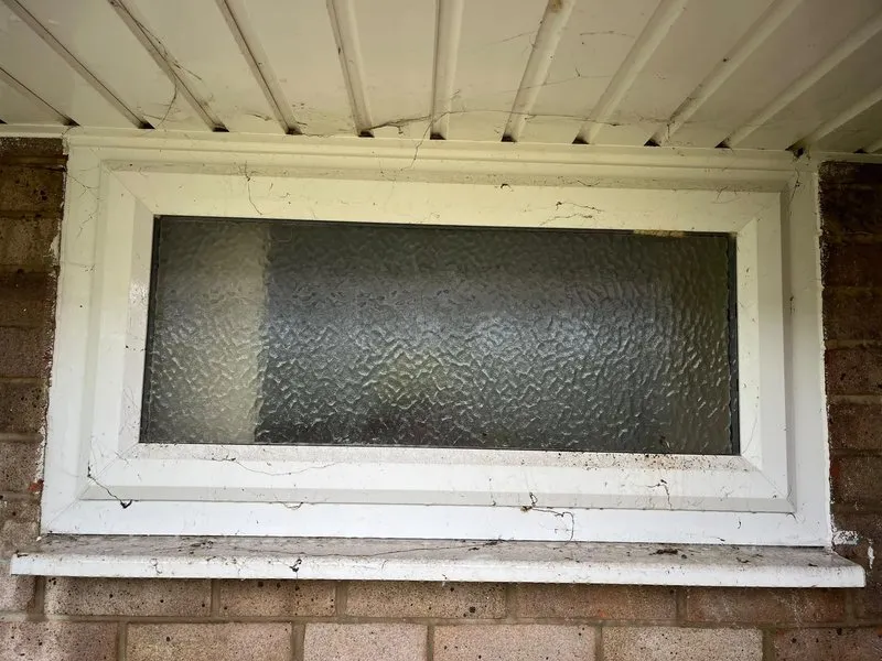 Dirty window frame and sill before cleaning